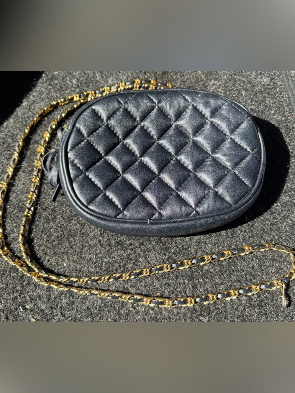 Quilted Oval Crossbody Bag in Black with Gold Chain by L. J. Simone